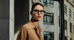 Woman wearing Rayban Meta Blayzer Optics (Gen 2) with Solid Matt Black frames with Clear lenses.